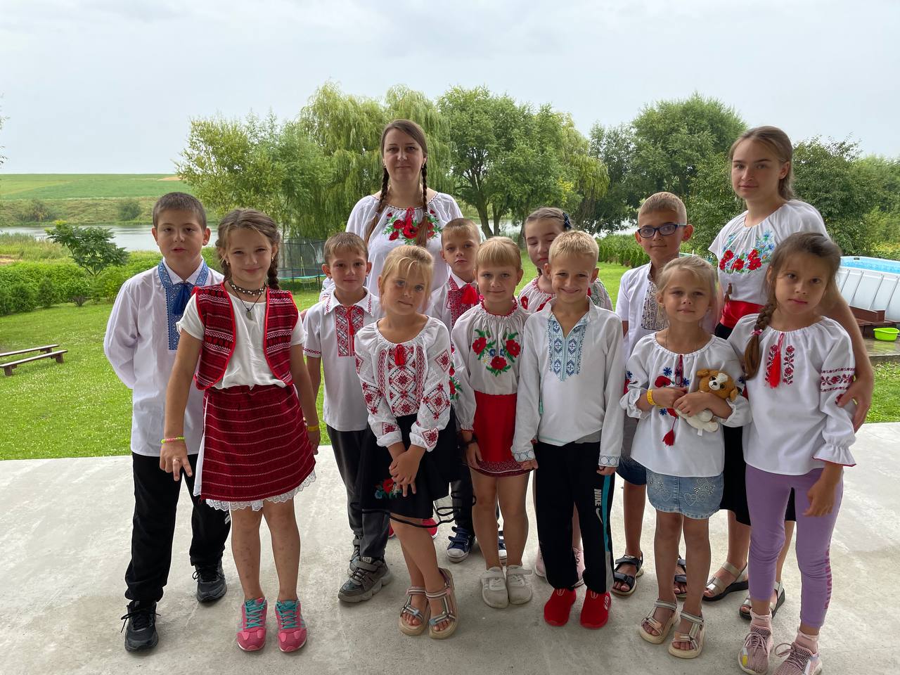 Children in traditional Ukrainian shirts at a Mission 823 youth camp