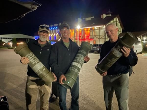 Holding expended artillery canisters